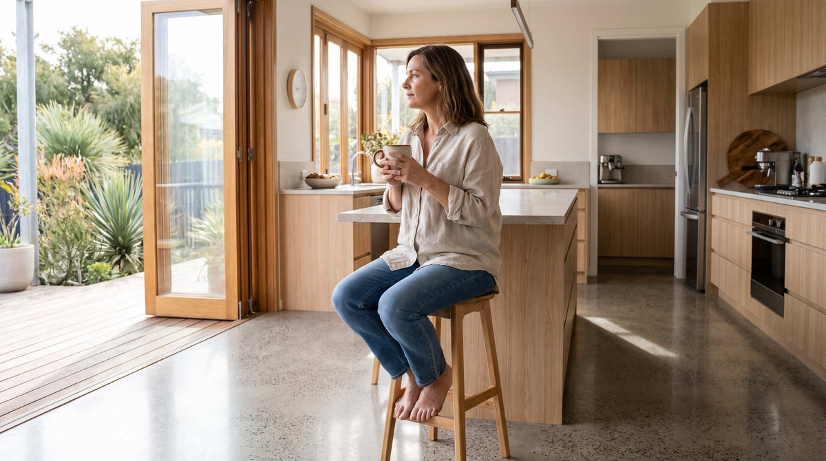 Australian woman with coffee, reflecting on habits affecting bladder health